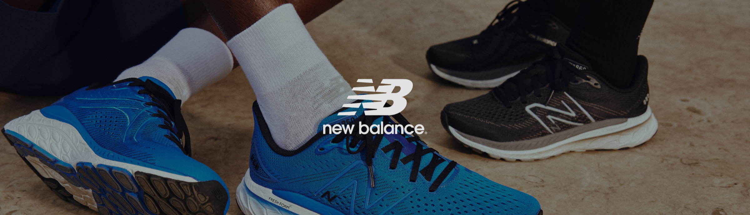 Blue New Balance running shoes worn by a person on a neutral background